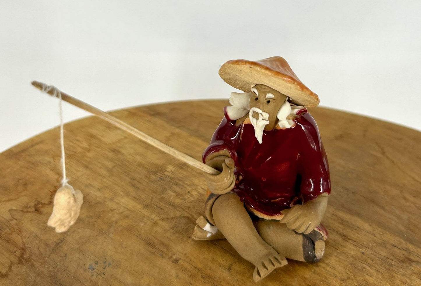 Miniature Ceramic Glazed Fisherman Figurine Red 2.0"