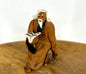 Miniature Ceramic Figurine  Mud Man Reading Book - 1.75"