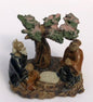 Miniature Ceramic Figurine  Two Men Sitting at a Table Under a Tree  Blue & Brown Color