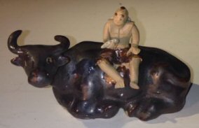 Ceramic Figure Man Sitting On Sitting Buffalo Large