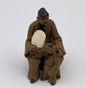 Ceramaic Figurine  Mom & Son Sitting On A Bench - 2.25"