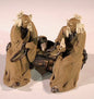 Ceramic Figurine Two Mud Men Sitting On A Bench with Musical Instrument - 2"