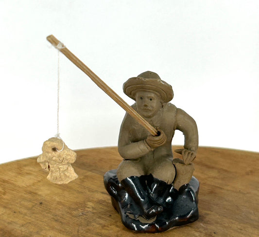 Glazed Fisherman Figurine Sitting on a Rock - 1.75"