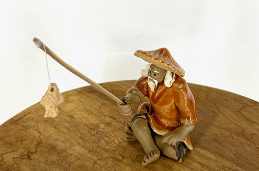 Miniature Ceramic Glazed Fisherman Figurine Orange 2.0"