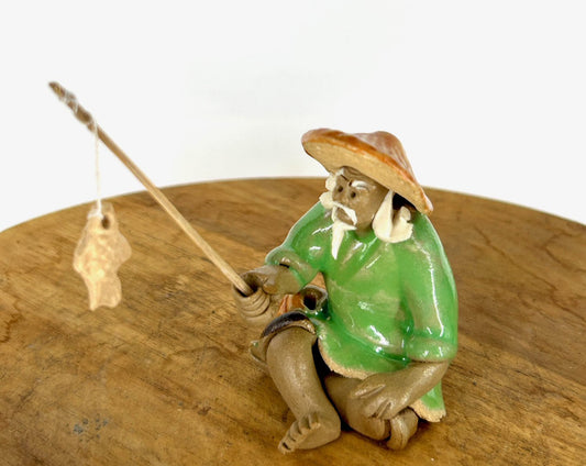 Miniature Ceramic Glazed Fisherman Figurine Light Green 1.25"