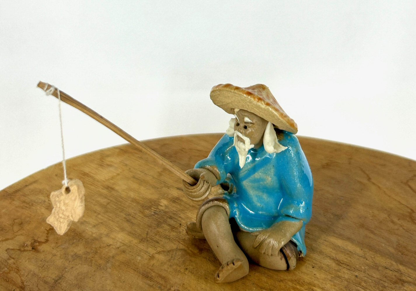 Miniature Ceramic Glazed Fisherman Figurine Light Blue 2.0"
