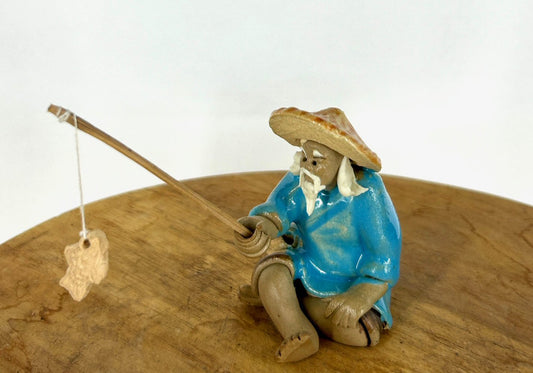 Miniature Ceramic Glazed Fisherman Figurine Light Blue 1.25"