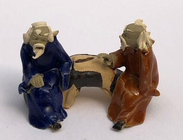Ceramic Figurine Two Men Sitting On A Bench - 2" Color: Blue & Orange