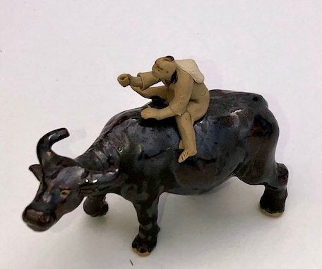 Ceramic Figure Man Ridding on Buffalo