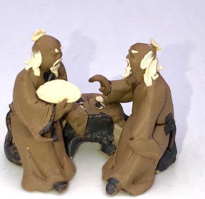 Miniature Ceramic Figurine Two Mud Men Sitting On A Bench Playing Chess - 1.5"