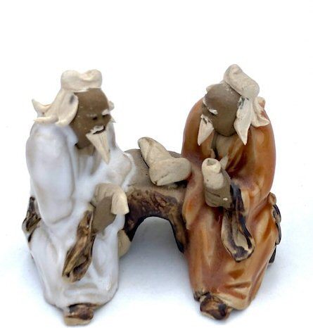 Ceramic Figurine Two Men Sitting On A Bench - 2" Color: Orange & White