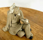 Miniature Ceramic Figurine Sitting Mud Man with Pipe - 2"